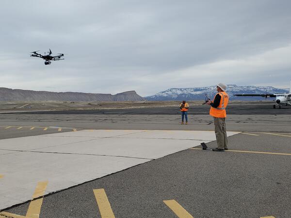 Drone being controlled by pilot at Grand Junction (Colorado) Airport