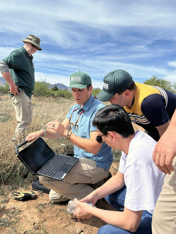 USGS staff demonstrate to Uzbek researchers the process of collecting and recording USGS groundwater data