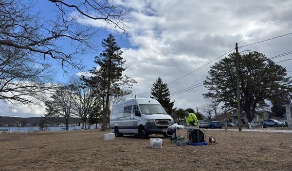 Collecting groundwater samples from a monitoring well. 