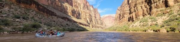 People in a raft during a science trip on the Colorado River floating through Grand Canyon