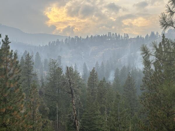 The Rail Ridge Fire burns in the distance in Oregon