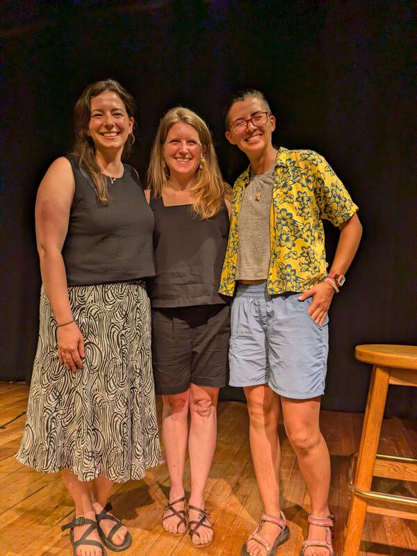 three people posing for photo together