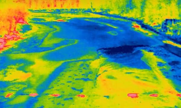 Thermal Image of the Ice on the Delaware River with bright red circles indicating the warmer water exposed by the boreholes