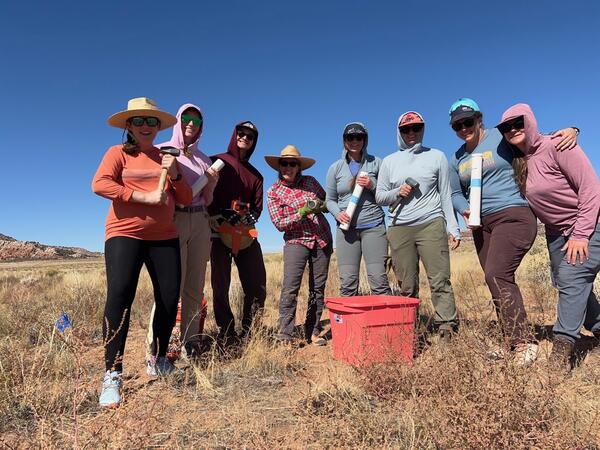 USGS staff and technicians pose for a photo during fieldwork near Moab, Utah