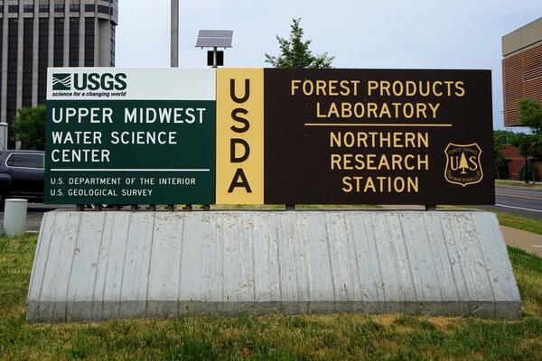 Two signs next to each other, left: USGS Upper Midwest Water Science Center, right: USDA Forest Products Laboratory