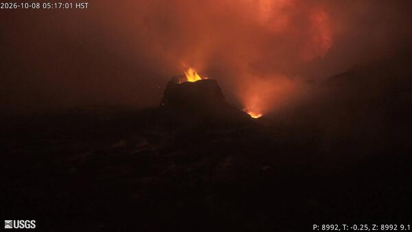Color photograph of flames within volcanic vents at night