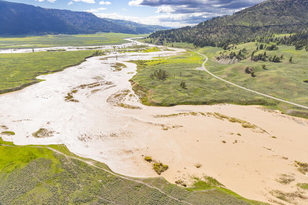 Water bursts over the banks of the Lamar River and Soda Butte Creek in Yellowstone National Park during the 2022 floods. 