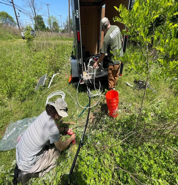 Scientists setting up storm sampling equipment