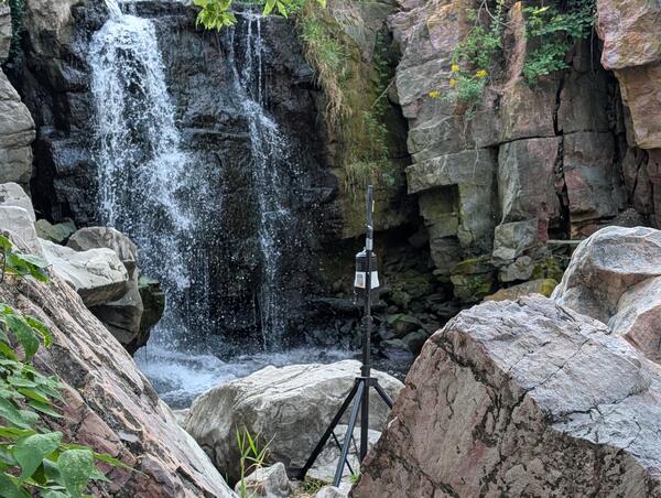Air sampling equipment at base of waterfall