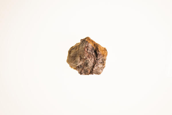 Isolated USGS mineral specimen of barite with visible crystal faces and granular texture.