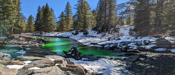 Image of dye in water during dye tracer study on the Slate River