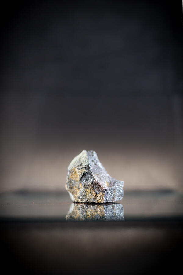 High-definition image showing granular texture and dark coloration.