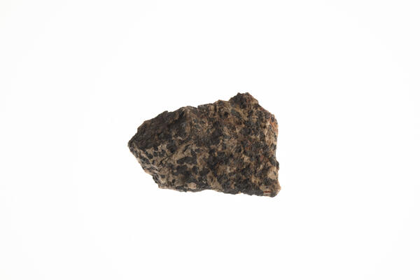 Isolated USGS mineral specimen featuring franklinite, zincite, and calcite.