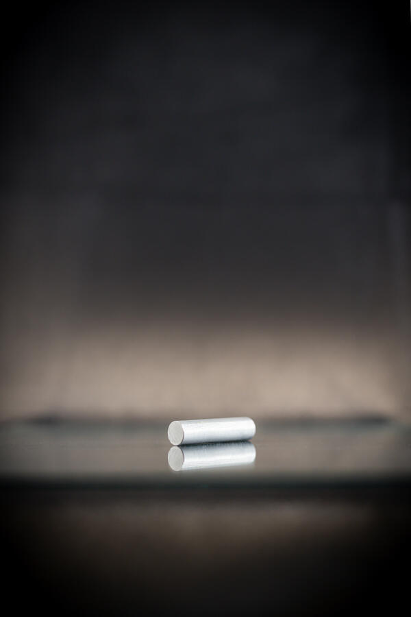 High-definition image of magnesium specimen with fine-grained texture and silvery color.