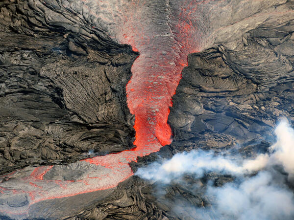 February 17, 2022 — Typical activity at the west vent in Halema‘uma‘u, Kīlauea Color photograph of lava flow