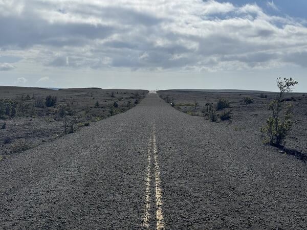 Color photograph of tephra on road