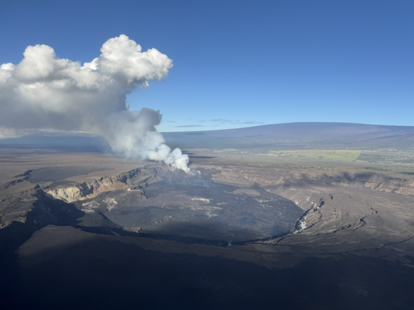 Color photograph of eruption within crater