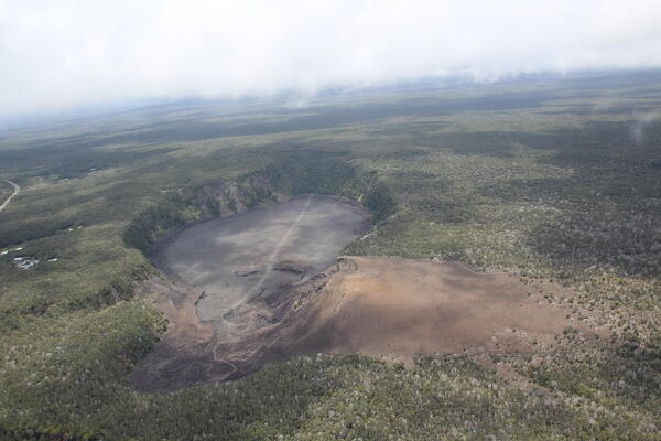 Color photograph of volcanic crater and cone