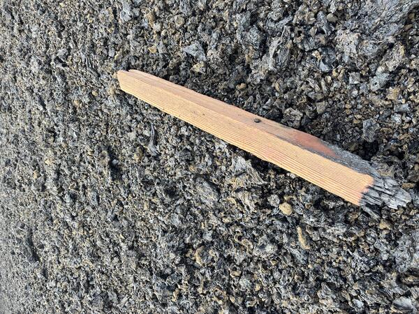 Color photograph of damaged post