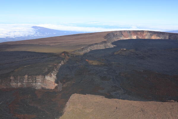 Color photograph of summit caldera at top of volcano