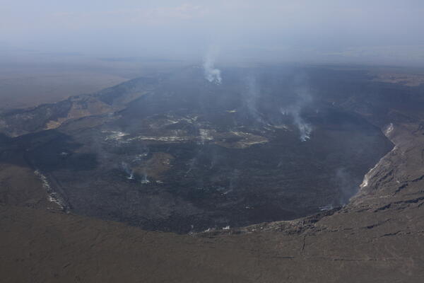 Color photograph of volcanic crater degassing