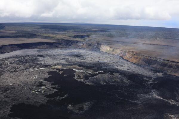 Color photograph of crater with lava flows in it
