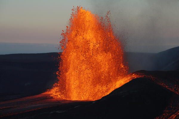 Color photograph of lava fountain in the evening