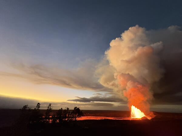 Color photograph of lava fountain during sunrise
