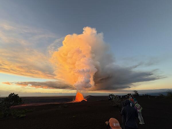 Color photograph of lava fountain and eruptive plume