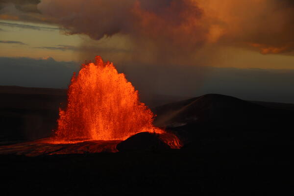 Color photograph of lava fountain at sunrise