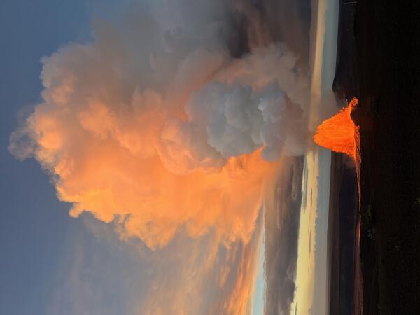 Color photograph of lava fountain at sunrise