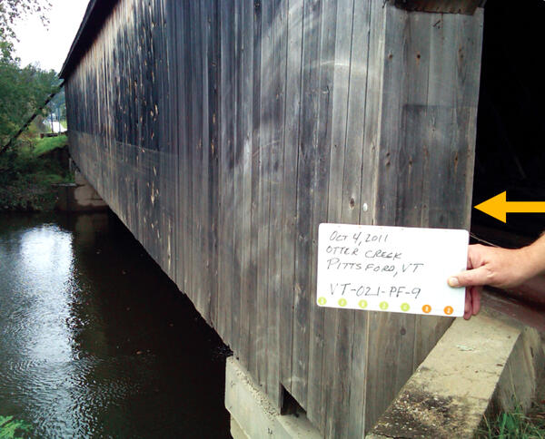 Covered bridge showing a high-water mark from tropical storm Irene
