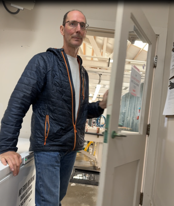 Paul Hershberger, a scientist, standing in a doorway in the Marrowstone Marine Field Station Lab