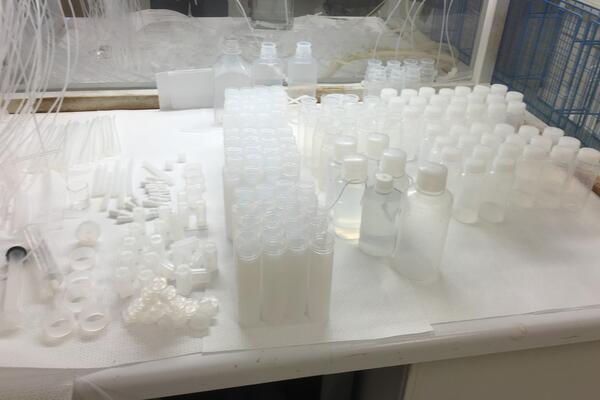 An assortment of white plastic Teflon sample bottles 