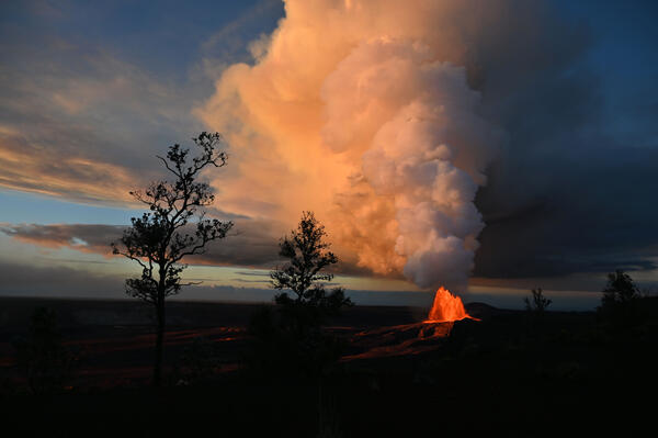 Color photograph of lava fountain and eruptive plume
