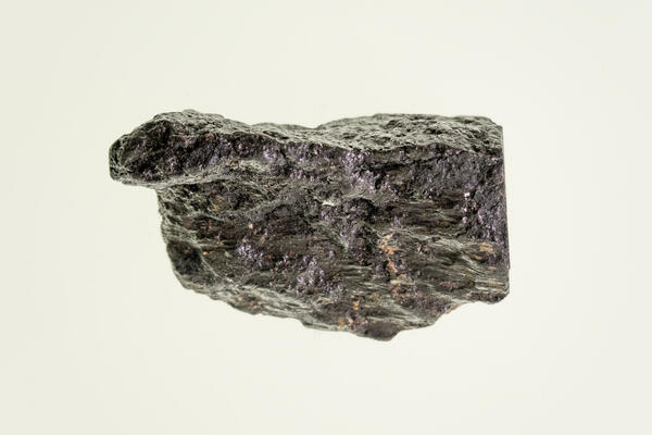 High-definition image of silver-bismuth ore specimen with dark matrix and metallic flecks.