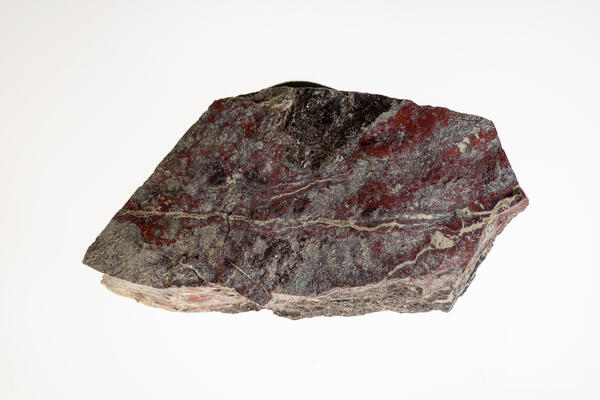 High-definition image of sphalerite and serpentine specimen with layered structure and greenish hue.