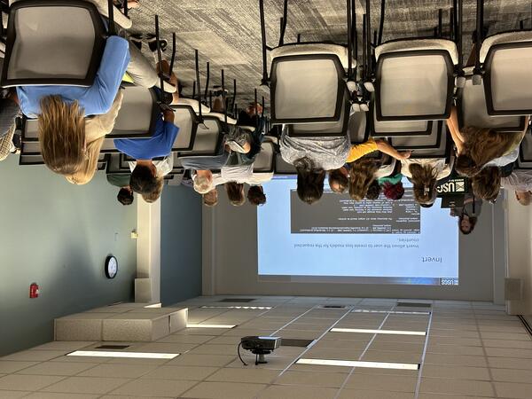 Intern presenting oral presentation with slideshow 