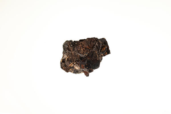 High-definition image of wolframite specimen with granular texture and black coloration.