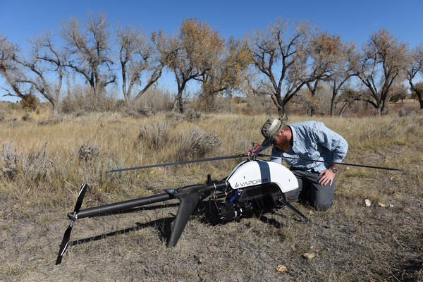 USGS researcher prepares a UAS with a mounted lidar sensor 