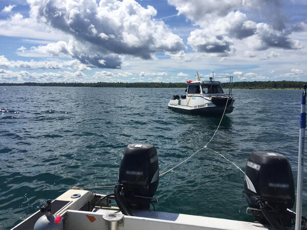 Tethered Boats Keeping a Distance
