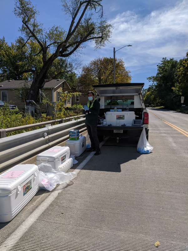 USGS scientist watches over the many samples collected during the red-dye study trial run in Desoto, Kansas. 