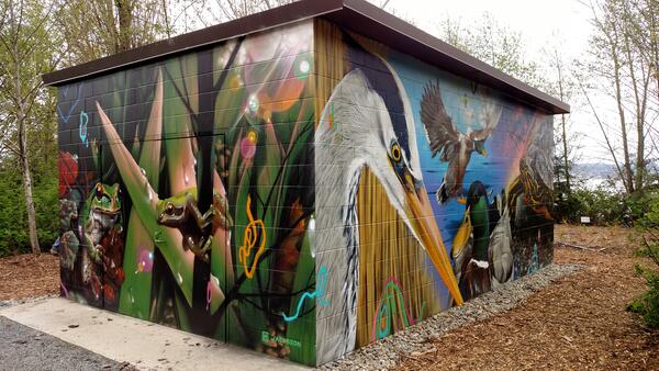 Murals on the USGS Western Fisheries Research Structure Pump House structure by Jeff Jacobson. 