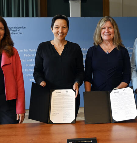 Photo of USGS and German Aerospace Center sign statement of intent for upcoming Landsat Next mission.