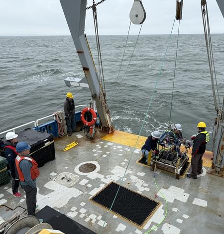 People working on a ship at sea