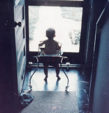 TNMCorps volunteer Spirit_of_Fundy as a baby staring out of a screen door. 