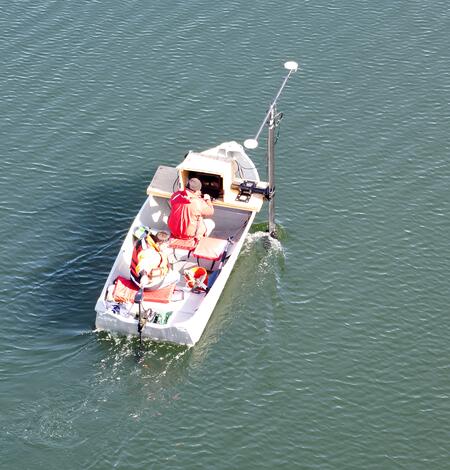 aerial view of small boat on pond