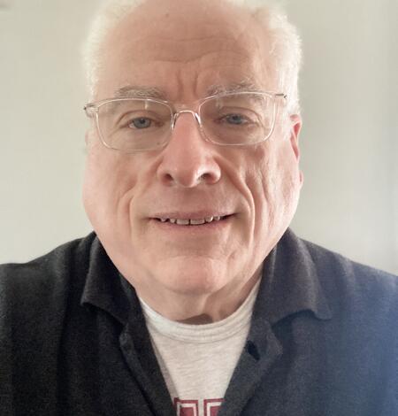 TNMCorps volunteer MRWert513 wearing glasses and a collared shirt. 