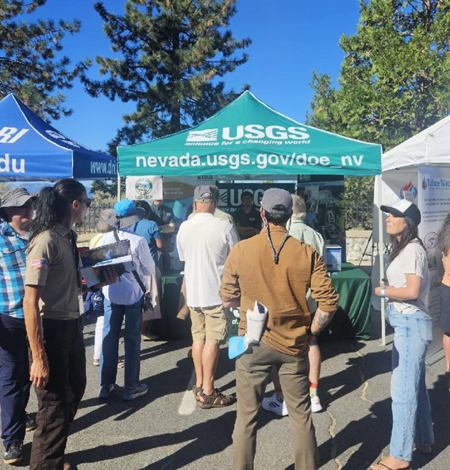 Attendees gather at the USGS booth at the 2026 Tahoe Summit