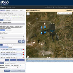 USGS Earth Explorer web tool showing an example of the geographic area and date range search criteria for Yellowstone